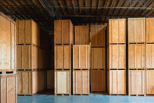 Storage solutions with crates made of wood interior. Logistics and Distribution