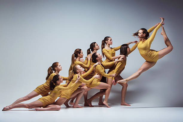 The group of modern ballet dancers The group of modern ballet dancers dancing on gray background performing arts event stock pictures, royalty-free photos & images