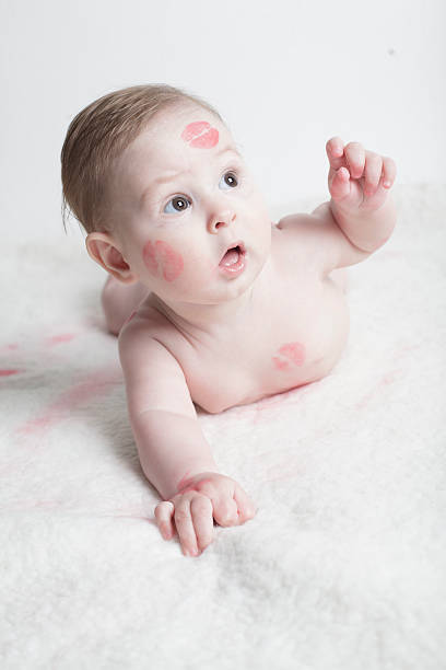 istock cute baby with kisses raised his hand 511313014