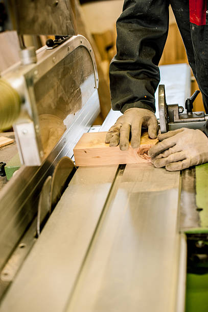 istock Carpenter Using Table Saw in Woodshop, Close-up 511313026