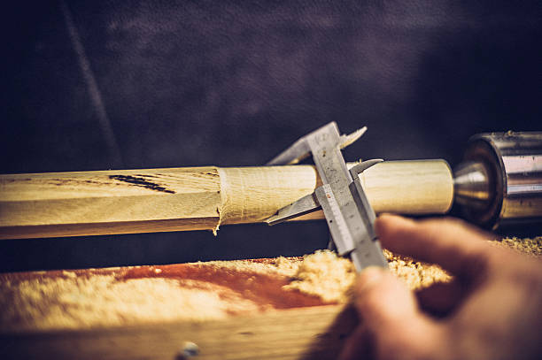 istock Craftsperson Measuring Wood Thickness with Calipers, Copy Space 511317472