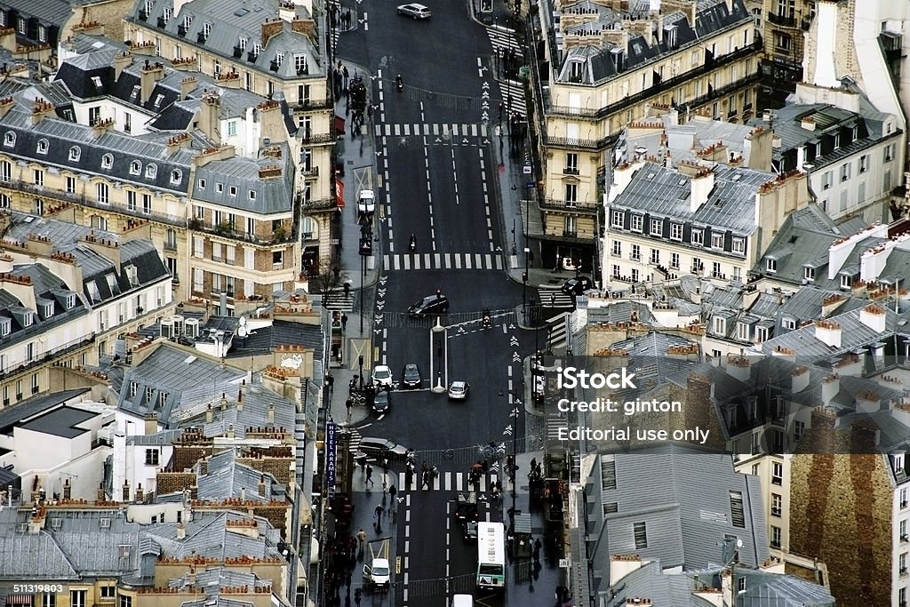 Paris traffic Paris, France - December 31, 2013: The aerial view of a main road with road transport, a bus stop and pedestrians on December 31, 2013 in Paris. Aerial View Stock Photo