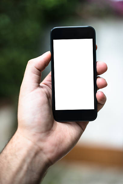 istock Hand holding Smartphones with Blank Screen 511320446