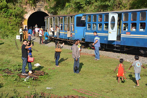Mettupalayam, India - October 29, 2015 - Tourists in front of famous toy train in Unesco World heritage