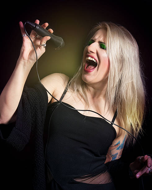 istock Blonde woman singer 511320586