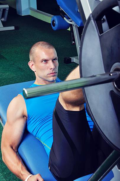 istock Muscular man exercising in a gym 511320877