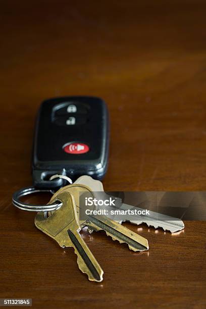 Key Fob For A Car And House Keys On A Table Stock Photo - Download Image Now - Brass, Car Key, Close-up