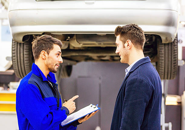 istock Auto Mechanic Talking With Car Owner 511324440