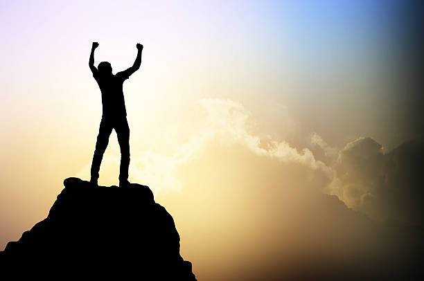 istock Man on the peak of mountain 511324478