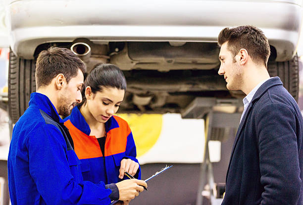 istock Auto Mechanics Talking With Car Owner 511324784