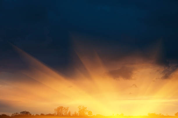 Burst of the sunset over dramatic sky