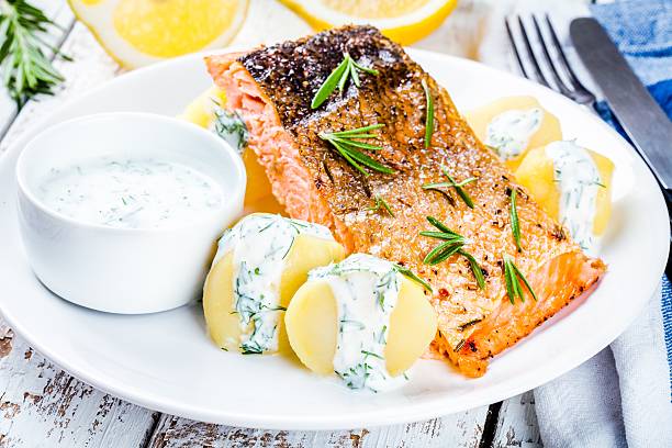 istock Baked salmon fillet and boiled potatoes 511326640