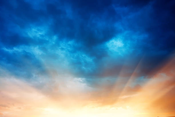 Burst of the sunset over dramatic sky