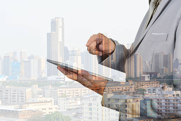 istock Double Exposure of Business Man using Mobile Tablet 511326994