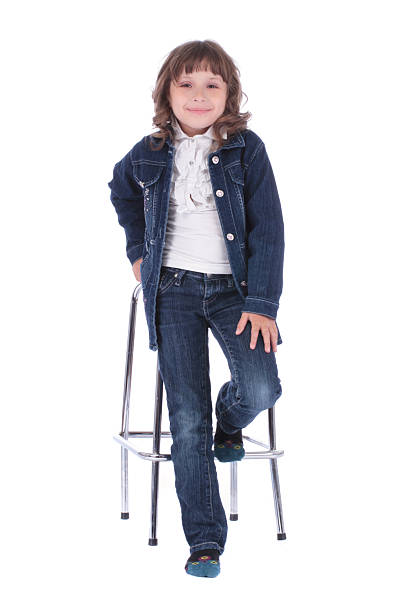 istock Little girl on the chair in studio 511327037