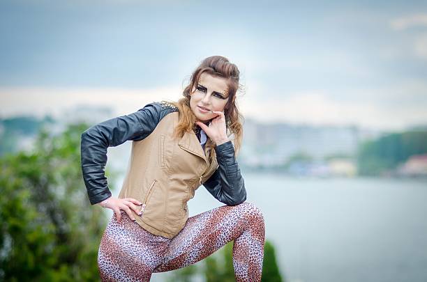 istock Attractive girl with makeup wild leopard on nature 511327337