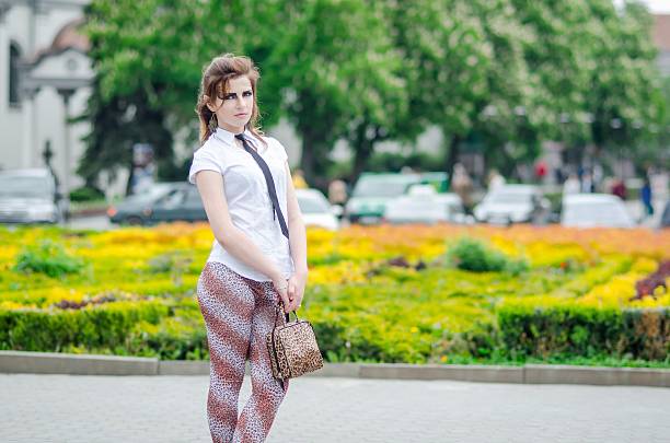 istock Attractive girl with makeup wild leopard on nature 511327339
