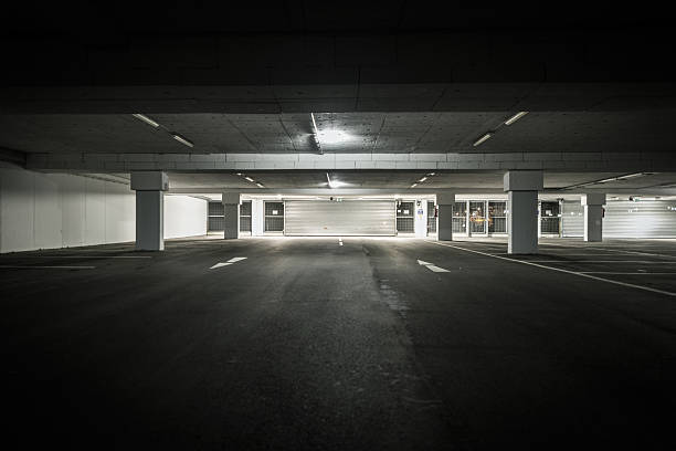 istock underground parking garage with view to sectional door 511328086