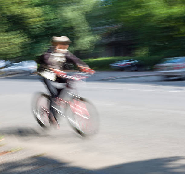 istock Boy cyclist in traffic on the city roadway 511348879