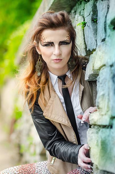 istock Attractive girl with makeup wild leopard on nature 511349285