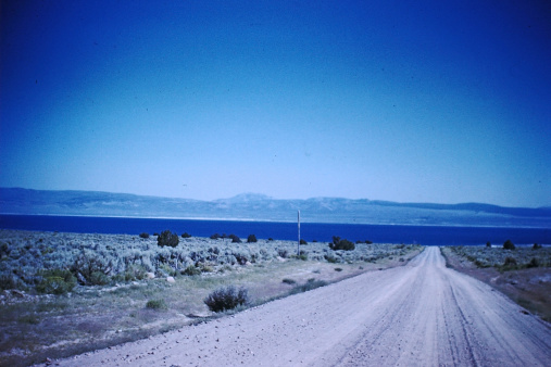 1960s scanned slide of gravel road approach to California's Mono Lake Horizontal.