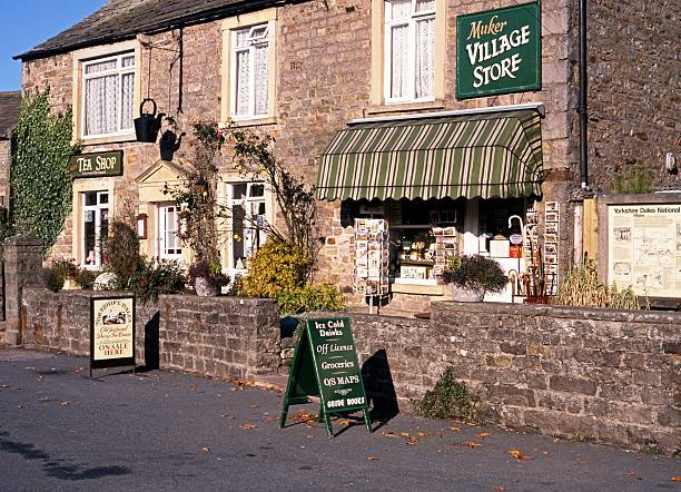 Muker, United Kingdom - October 18, 1993:  View of the village store and tea shop with an a-board outside in the village centre, Muker, Swaledale, Yorkshire Dales, North Yorkshire, England, UK, Great Britain, Western Europe.