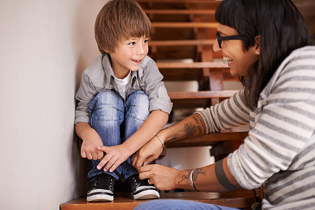 Now you try... A young mother helping her son tie his shoeshttp://195.154.178.81/DATA/shoots/ic_783778.jpg child tied up stock pictures, royalty-free photos & images