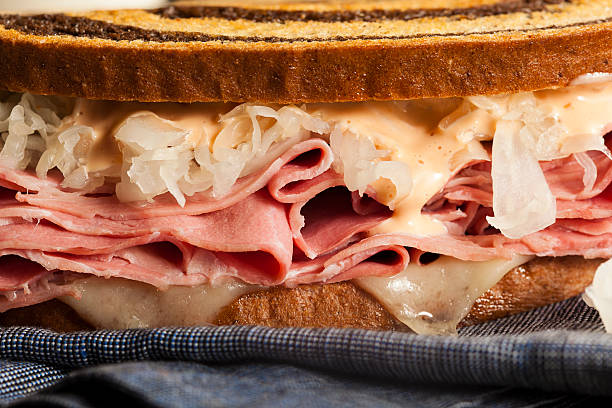 Homemade Reuben Sandwich Homemade Reuben Sandwich with Corned Beef and Sauerkraut reuben sandwich stock pictures, royalty-free photos & images