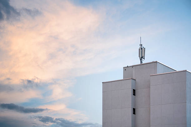 cell phone tower at dusk stock photo