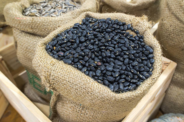 istock Pile of black bean in fabric sack 511354235