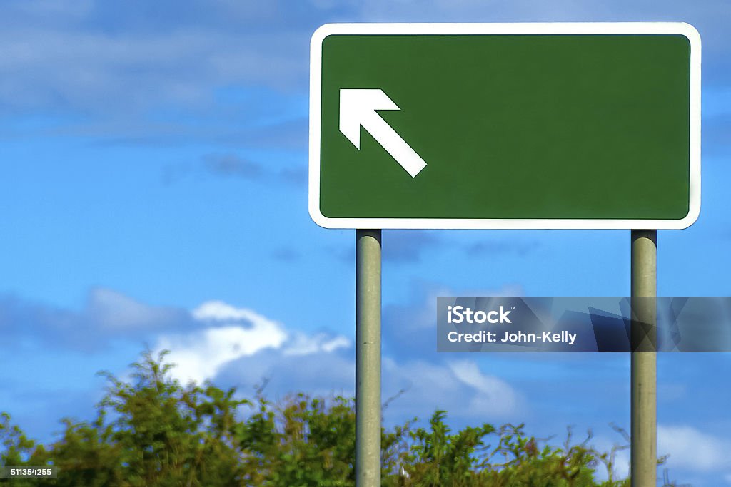 Blank British Road Sign A motorway sign with an arrow in England, blank for your own text to be inserted. Road Sign Stock Photo