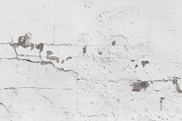 istock Old concrete wall with white paint, background photo texture 511354851