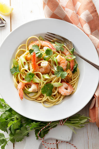 istock Italian Stills: Spaghetti with Shrimps, Spring Onions and Coriander 511355507