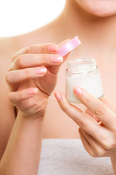 istock Skin care. Girl applying moisturizing cream. 511356621