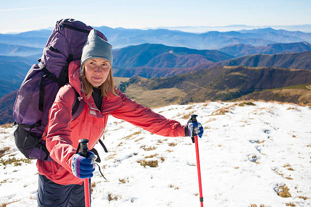 istock Girl with the backpack goes through the snow 511363662