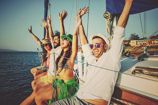 Young people having fun on a yacht.