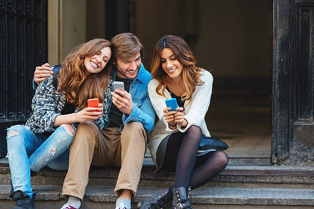 istock Group of friends with mobile phones 511364932