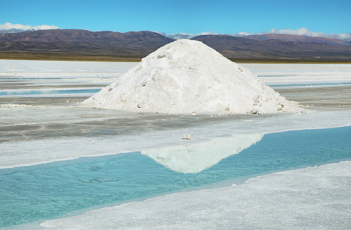 Salt piles and water pool on Salinas Grandes salt flats in Jujuy province, northern Argentina.