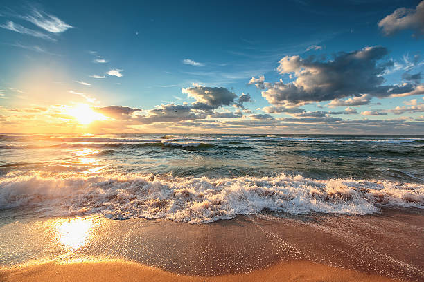 Beautiful cloudscape over the sea Beautiful cloudscape over the sea, sunrise shot horizon over land stock pictures, royalty-free photos & images