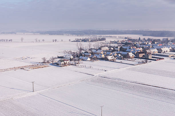 istock aerial view  over the harvest fields in winter 511367580