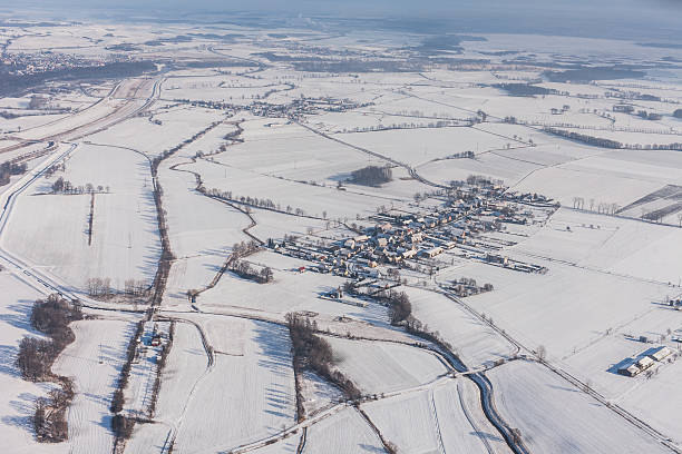 istock aerial view  over the harvest fields in winter 511369970