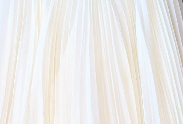 istock Background of white pleated fabric 511371650