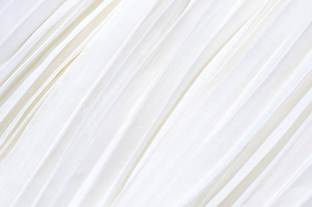 istock Background of white pleated fabric 511371768