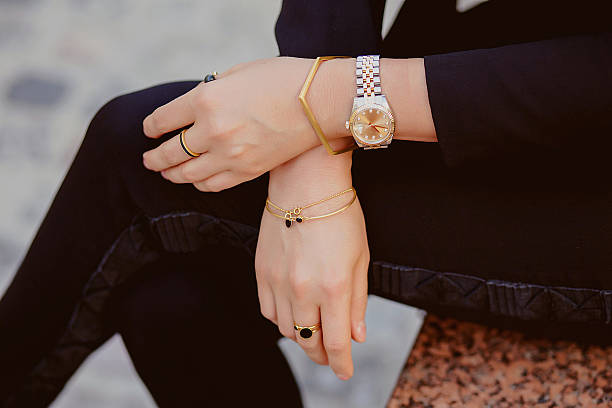 Jewellery closeup on female hands Beautiful jewelry, bracelets, watches, rings, female hands. Close-up jewelry stock pictures, royalty-free photos & images
