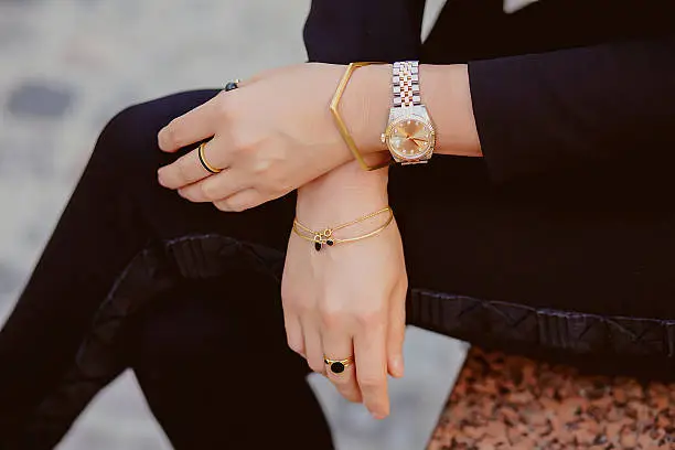 Beautiful jewelry, bracelets, watches, rings, female hands. Close-up