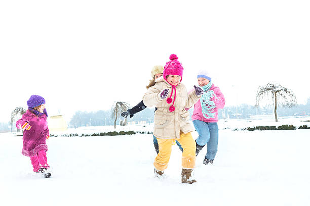 istock Cute family having fun in the snow 511376634