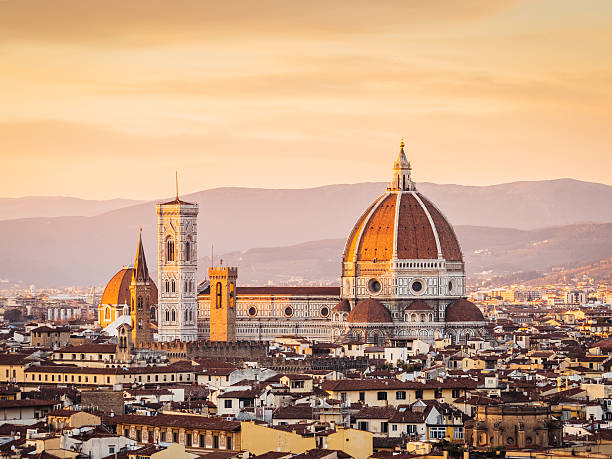 Florence's cathedral and skyline at sunset Florence's cathedral and skyline at sunset filippo brunelleschi stock pictures, royalty-free photos & images