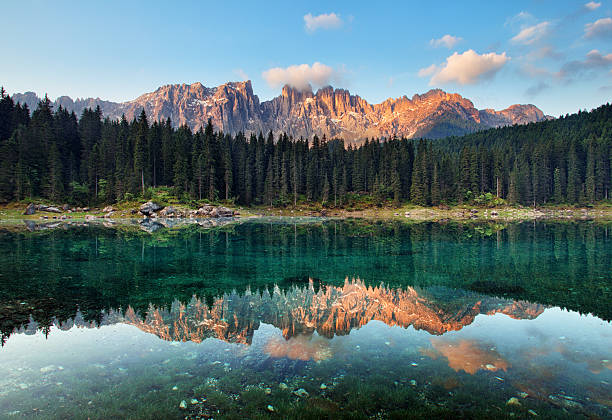 istock Lake with mountain forest landscape, Lago di Carezza 511377282