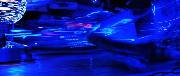 istock Blurred lights of a fairground carousel background 511379362