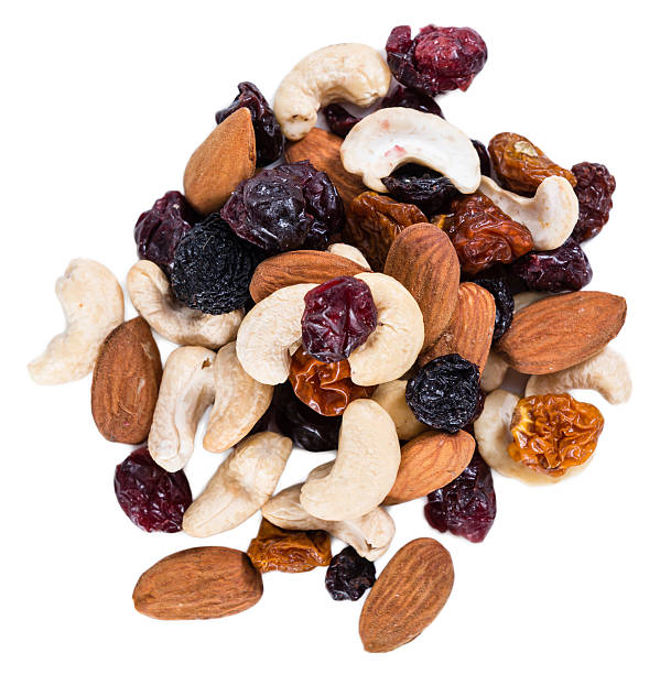 Trail Mix isolated on white Trail Mix isolated on white background (close-up shot) dried fruit on white stock pictures, royalty-free photos & images